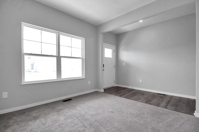 294 Shady Hollow Dr, Commercial Point, OH 43116 - foyer featuring dark carpet and baseboards