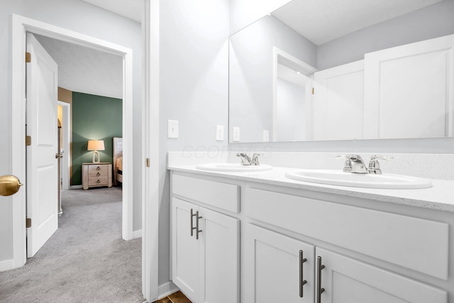 294 Shady Hollow Dr, Commercial Point, OH 43116 - ensuite bathroom with double vanity and baseboards