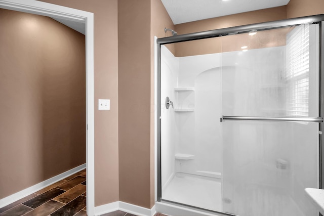 294 Shady Hollow Dr, Commercial Point, OH 43116 - full bathroom featuring a stall shower and baseboards