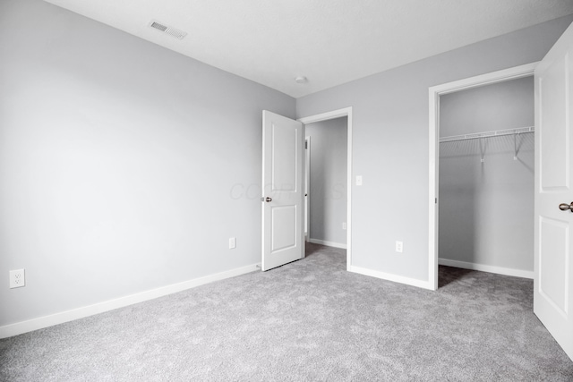 294 Shady Hollow Dr, Commercial Point, OH 43116 - unfurnished bedroom with carpet floors, baseboards, a closet, and a spacious closet