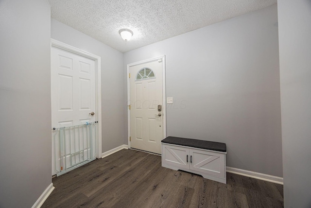 1427 Trabue Woods Blvd, Columbus, OH 43228 - entrance foyer with dark wood-style floors, baseboards, and a textured ceiling