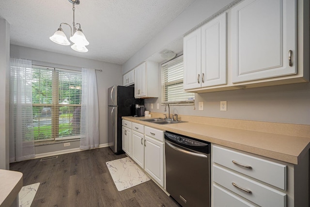 1427 Trabue Woods Blvd, Columbus, OH 43228 - kitchen featuring appliances with stainless steel finishes, a sink, a chandelier, white cabinets, and dark wood-style flooring