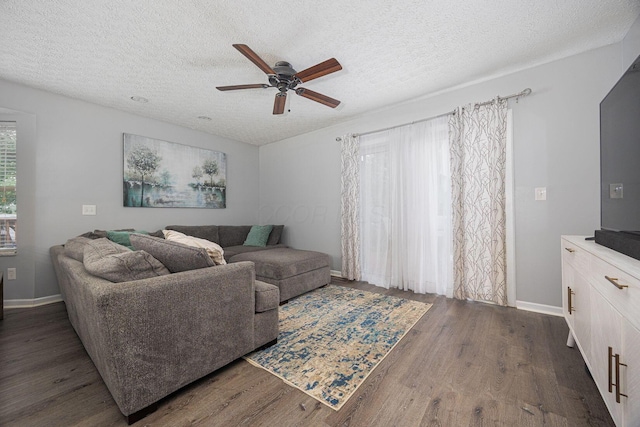 1427 Trabue Woods Blvd, Columbus, OH 43228 - living room with a ceiling fan, a textured ceiling, dark wood-type flooring, and baseboards