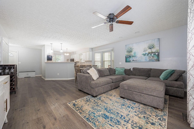 1427 Trabue Woods Blvd, Columbus, OH 43228 - living room featuring a textured ceiling, a ceiling fan, dark wood finished floors, and baseboards