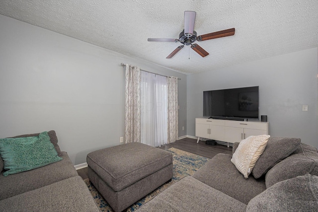 1427 Trabue Woods Blvd, Columbus, OH 43228 - living area with wood finished floors, a ceiling fan, a textured ceiling, and baseboards