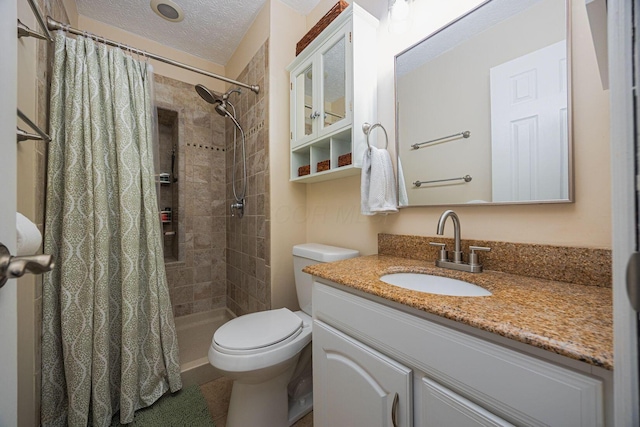 1427 Trabue Woods Blvd, Columbus, OH 43228 - full bathroom with vanity, toilet, tiled shower, and a textured ceiling