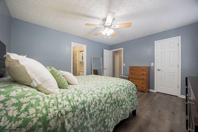 1427 Trabue Woods Blvd, Columbus, OH 43228 - bedroom featuring dark wood finished floors, a textured ceiling, ceiling fan, baseboards, and connected bathroom