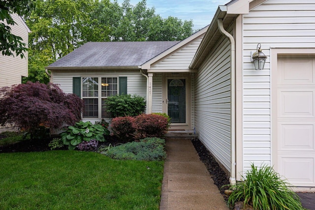 1427 Trabue Woods Blvd, Columbus, OH 43228 - entrance to property featuring a garage, a yard, and a shingled roof