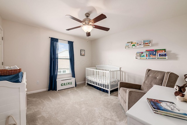 118 Firestone Dr, Delaware, OH 43015 - carpeted bedroom with a nursery area, baseboards, and a ceiling fan