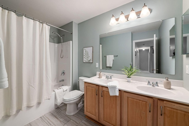 118 Firestone Dr, Delaware, OH 43015 - bathroom with shower / tub combo with curtain, double vanity, and toilet