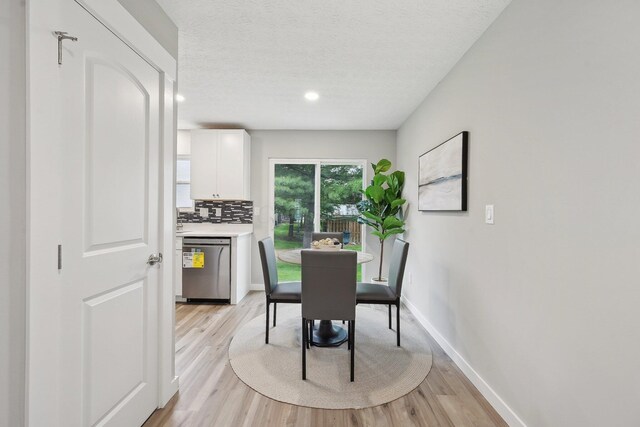 894 Noddymill Ln E Unit 28E, Columbus, OH 43085 - dining space with light wood-style floors, baseboards, a textured ceiling, and recessed lighting