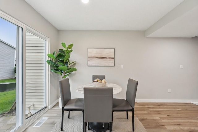 894 Noddymill Ln E Unit 28E, Columbus, OH 43085 - dining space with light wood finished floors and baseboards