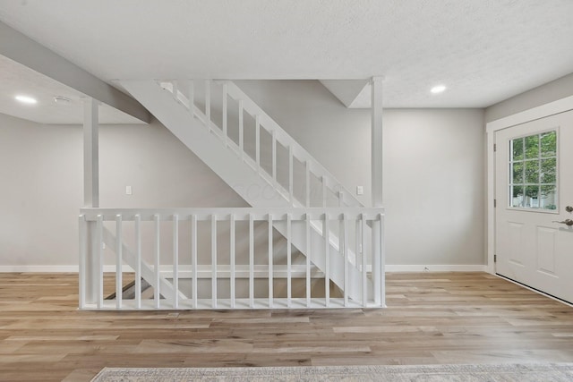 894 Noddymill Ln E Unit 28E, Columbus, OH 43085 - foyer entrance featuring wood finished floors, baseboards, recessed lighting, stairs, and a textured ceiling