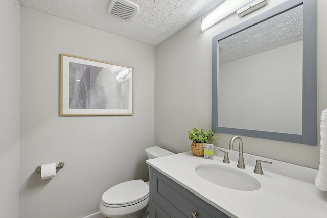 894 Noddymill Ln E Unit 28E, Columbus, OH 43085 - half bathroom with a textured ceiling, toilet, and vanity