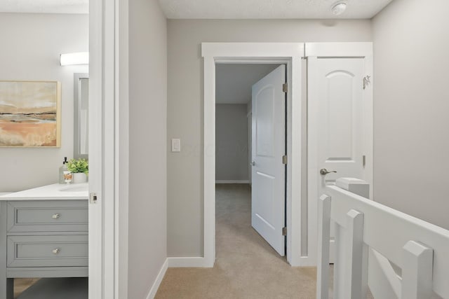 894 Noddymill Ln E Unit 28E, Columbus, OH 43085 - hall featuring light carpet and baseboards