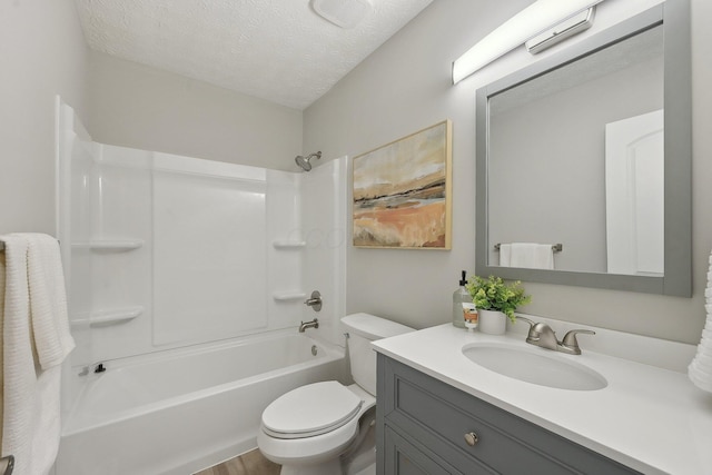 894 Noddymill Ln E Unit 28E, Columbus, OH 43085 - bathroom featuring toilet, vanity, washtub / shower combination, a textured ceiling, and wood finished floors