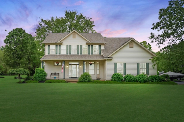6962 Whitetail Ln, Westerville, OH 43082 - view of front of house with a porch, a shingled roof, and a yard