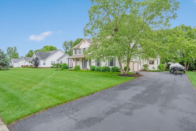 6962 Whitetail Ln, Westerville, OH 43082 - view of front of home featuring a front lawn, a garage, and driveway