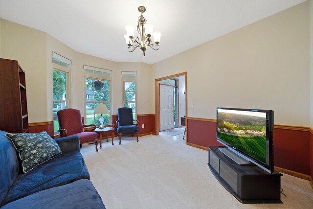 6962 Whitetail Ln, Westerville, OH 43082 - carpeted living area featuring a chandelier and baseboards