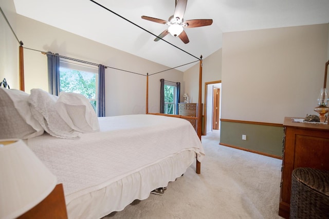 6962 Whitetail Ln, Westerville, OH 43082 - bedroom with light colored carpet, lofted ceiling, multiple windows, a ceiling fan, and baseboards