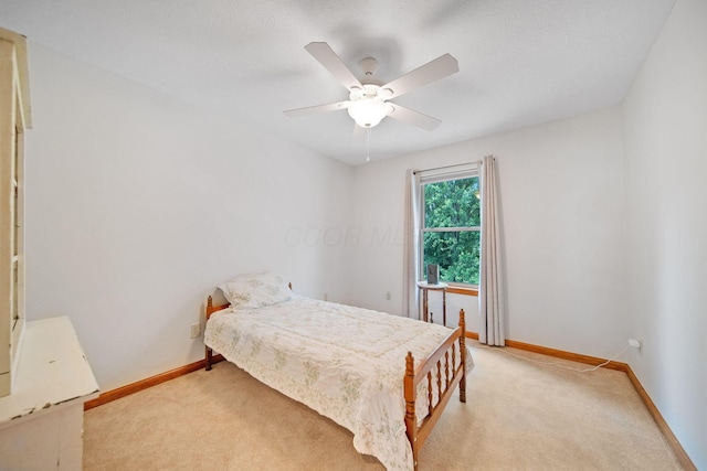6962 Whitetail Ln, Westerville, OH 43082 - bedroom featuring light carpet, baseboards, and a ceiling fan