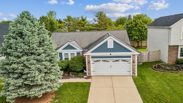 5718 Brook Hollow Dr, Hilliard, OH 43026 - view of front of property featuring a garage, brick siding, a shingled roof, and driveway