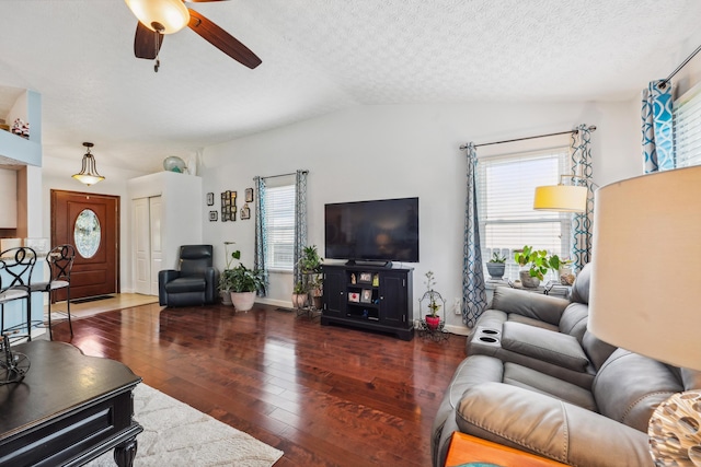 5718 Brook Hollow Dr, Hilliard, OH 43026 - living area with wood-type flooring, ceiling fan, healthy amount of natural light, a textured ceiling, and lofted ceiling