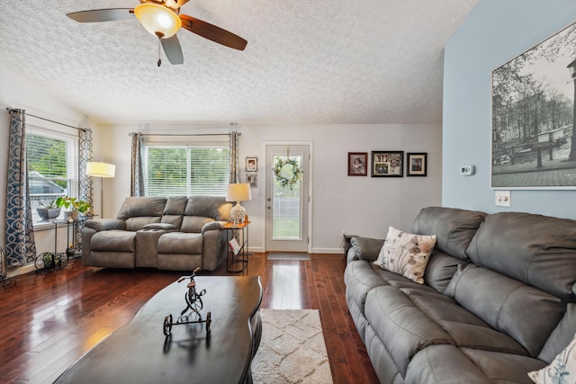 5718 Brook Hollow Dr, Hilliard, OH 43026 - living area with a textured ceiling, dark wood-style floors, a ceiling fan, and baseboards