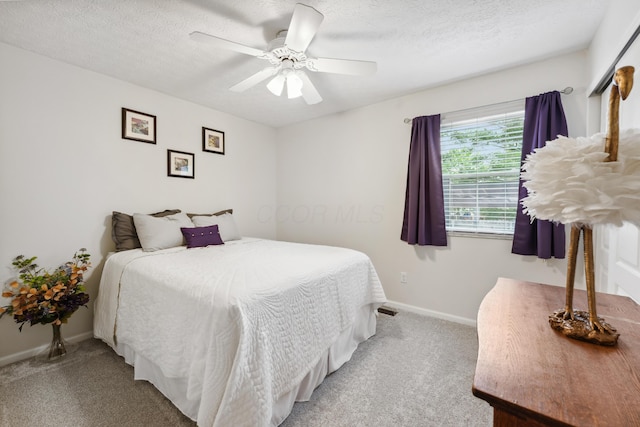 5718 Brook Hollow Dr, Hilliard, OH 43026 - bedroom with light colored carpet, baseboards, ceiling fan, and a textured ceiling