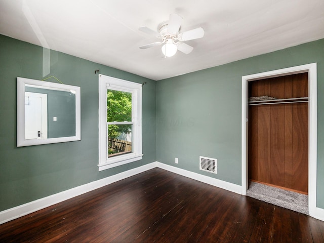 34 Columbus Ave, Delaware, OH 43015 - unfurnished bedroom with baseboards, wood finished floors, a closet, and ceiling fan