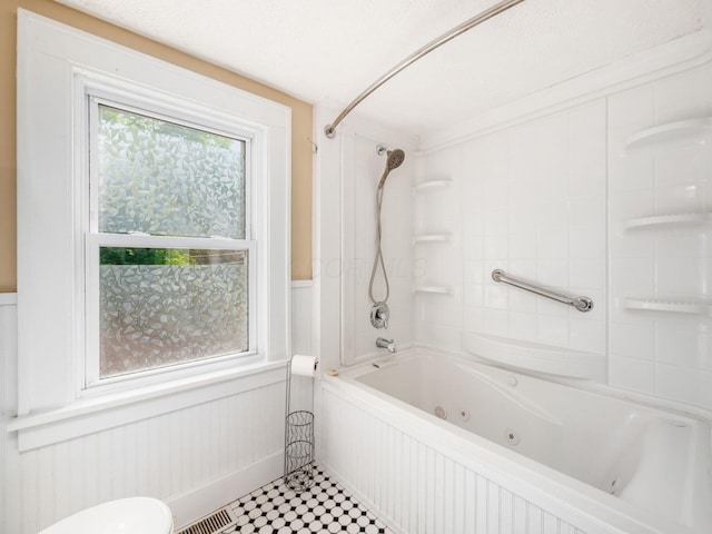 34 Columbus Ave, Delaware, OH 43015 - bathroom with a combined bath / shower with jetted tub, toilet, a decorative wall, and wainscoting