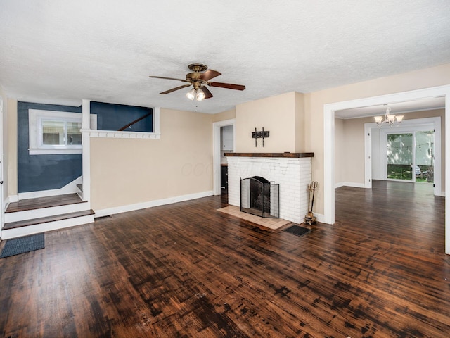 34 Columbus Ave, Delaware, OH 43015 - unfurnished living room with a chandelier, a ceiling fan, wood finished floors, a fireplace, and baseboards