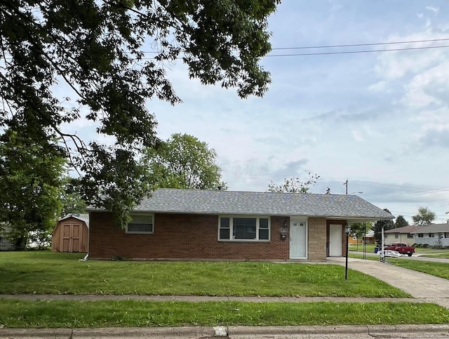 1562 Argus Rd, Columbus, OH 43227 - ranch-style house featuring driveway, a front lawn, brick siding, a carport, and a shingled roof