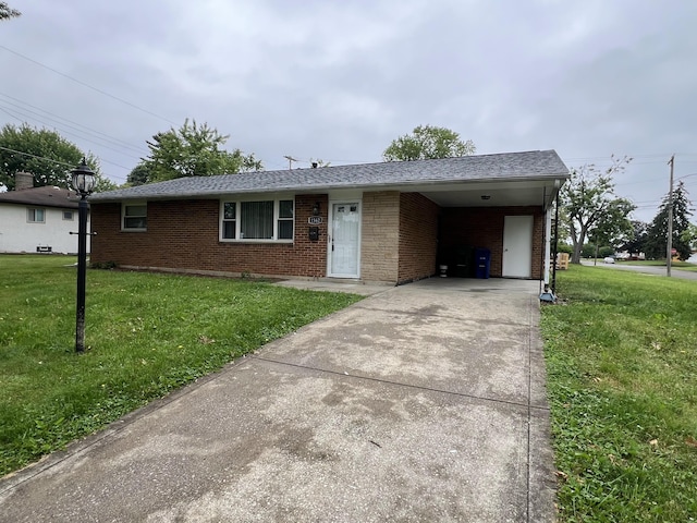 1562 Argus Rd, Columbus, OH 43227 - ranch-style home with concrete driveway, a front lawn, brick siding, an attached carport, and roof with shingles