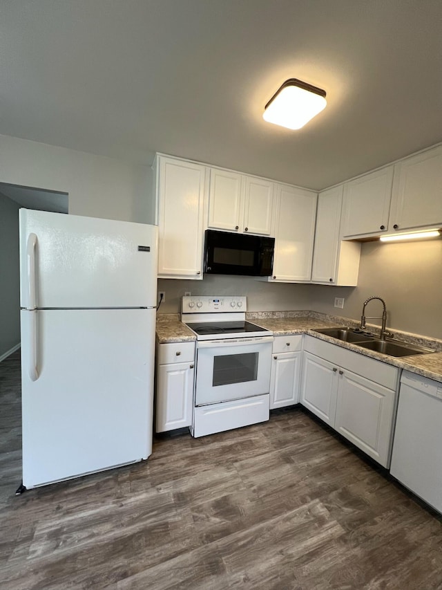 1562 Argus Rd, Columbus, OH 43227 - kitchen with white appliances, a sink, white cabinetry, dark wood-type flooring, and light countertops