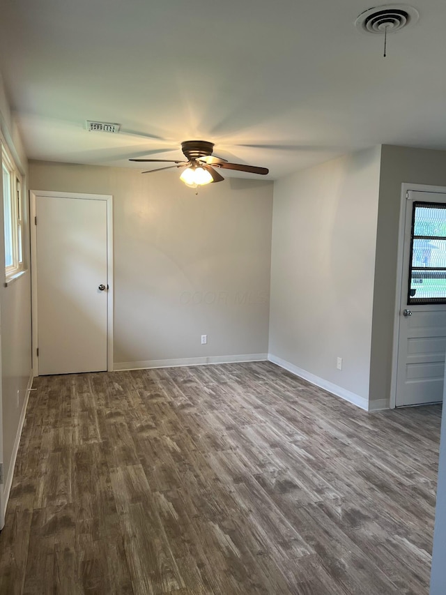 1562 Argus Rd, Columbus, OH 43227 - empty room with a ceiling fan, dark wood-type flooring, and baseboards