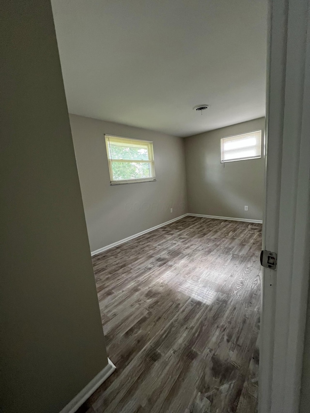 1562 Argus Rd, Columbus, OH 43227 - spare room featuring dark wood finished floors and baseboards