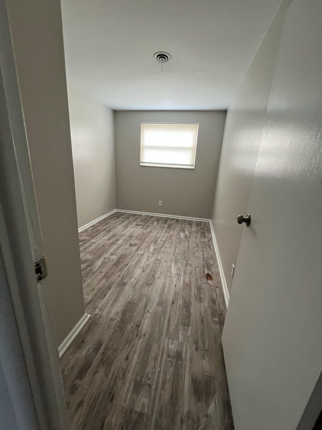 1562 Argus Rd, Columbus, OH 43227 - empty room with dark wood-style flooring and baseboards