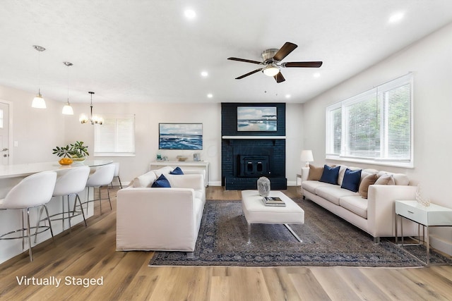 3998 Scioto Darby Creek Rd, Hilliard, OH 43026 - living room featuring healthy amount of natural light, wood finished floors, recessed lighting, and a chandelier