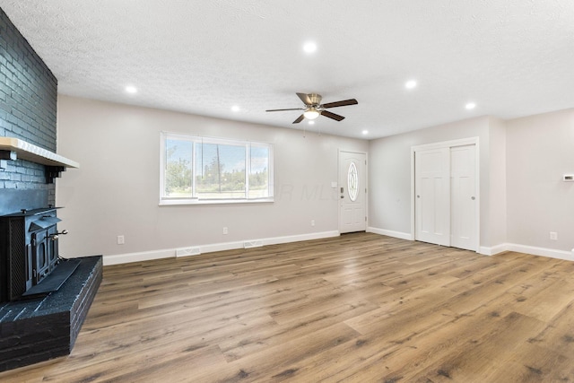 3998 Scioto Darby Creek Rd, Hilliard, OH 43026 - unfurnished living room featuring ceiling fan, wood finished floors, recessed lighting, baseboards, and a textured ceiling