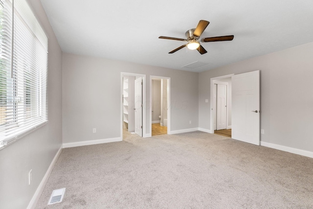 3998 Scioto Darby Creek Rd, Hilliard, OH 43026 - unfurnished bedroom featuring light colored carpet, ensuite bath, baseboards, and a ceiling fan