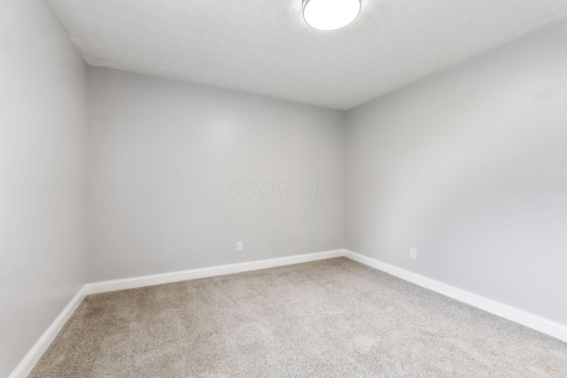 3998 Scioto Darby Creek Rd, Hilliard, OH 43026 - unfurnished room with carpet flooring, baseboards, and a textured ceiling