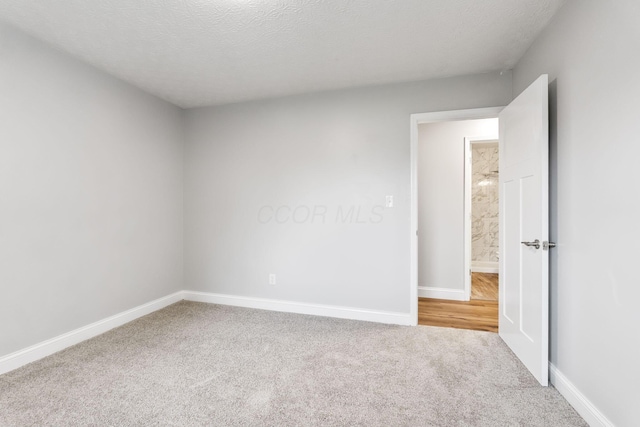 3998 Scioto Darby Creek Rd, Hilliard, OH 43026 - spare room with carpet floors, baseboards, and a textured ceiling