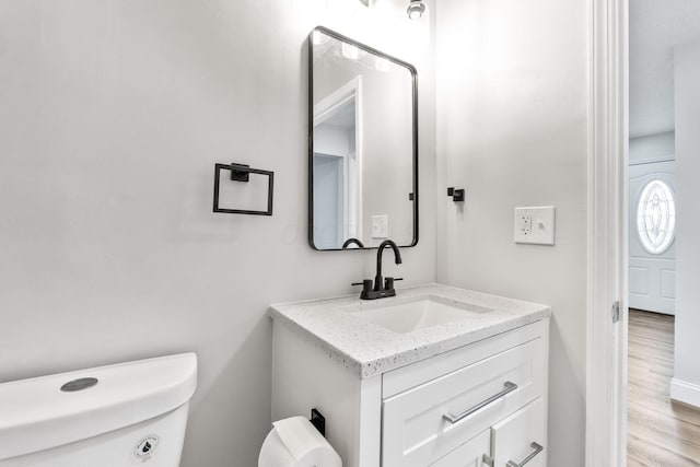 3998 Scioto Darby Creek Rd, Hilliard, OH 43026 - half bath with toilet, vanity, wood finished floors, and washer / clothes dryer