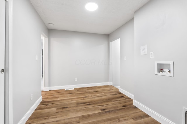 3998 Scioto Darby Creek Rd, Hilliard, OH 43026 - laundry area with washer hookup, wood finished floors, and baseboards