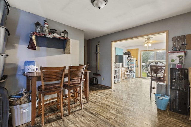 217 N Yencer St, Baltimore, OH 43105 - dining room with wood finished floors, baseboards, and a ceiling fan