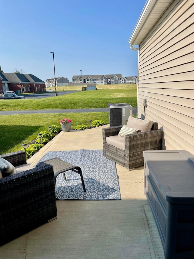 6231 Red Glare Dr Unit 287, Galloway, OH 43119 - view of patio / terrace with central AC unit and a residential view