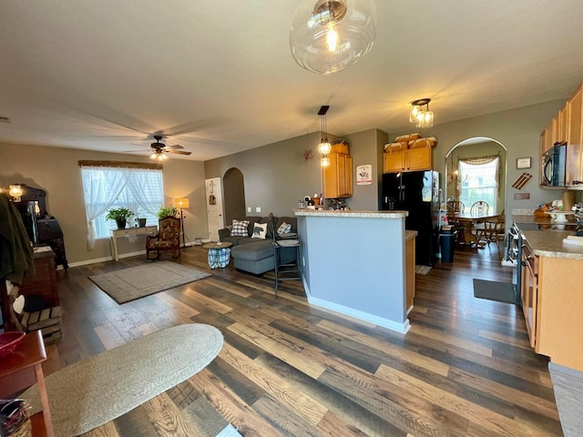 6231 Red Glare Dr Unit 287, Galloway, OH 43119 - kitchen with arched walkways, black appliances, and plenty of natural light