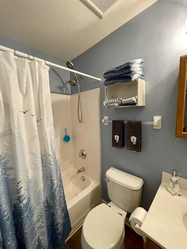 6231 Red Glare Dr Unit 287, Galloway, OH 43119 - bathroom featuring vanity, shower / bathtub combination with curtain, toilet, and a textured ceiling