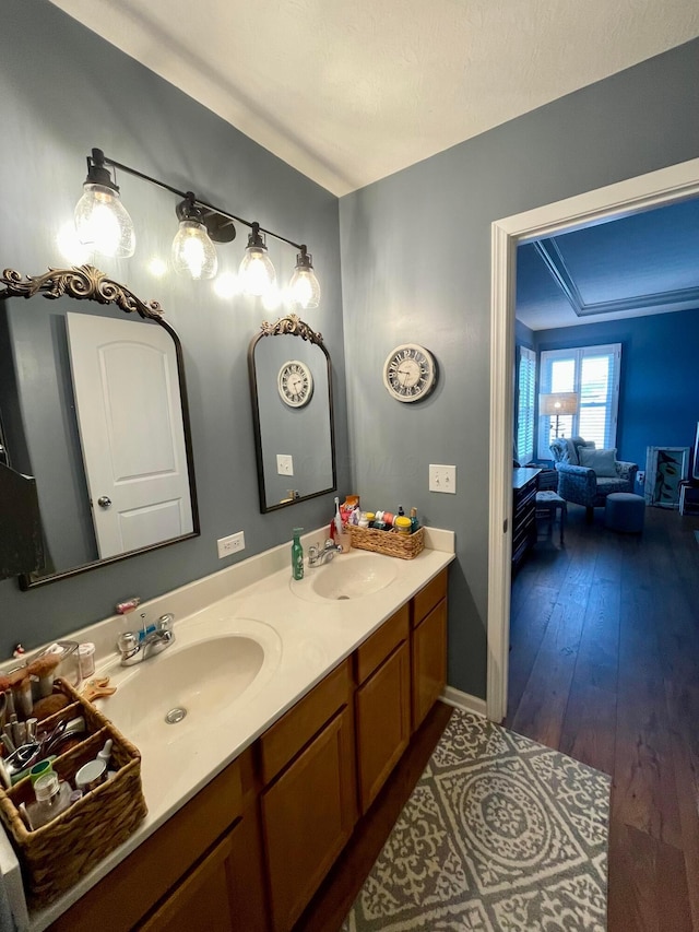 6231 Red Glare Dr Unit 287, Galloway, OH 43119 - full bath with double vanity, hardwood / wood-style floors, and baseboards